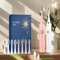 White electric toothbrush + pink electric toothbrush
